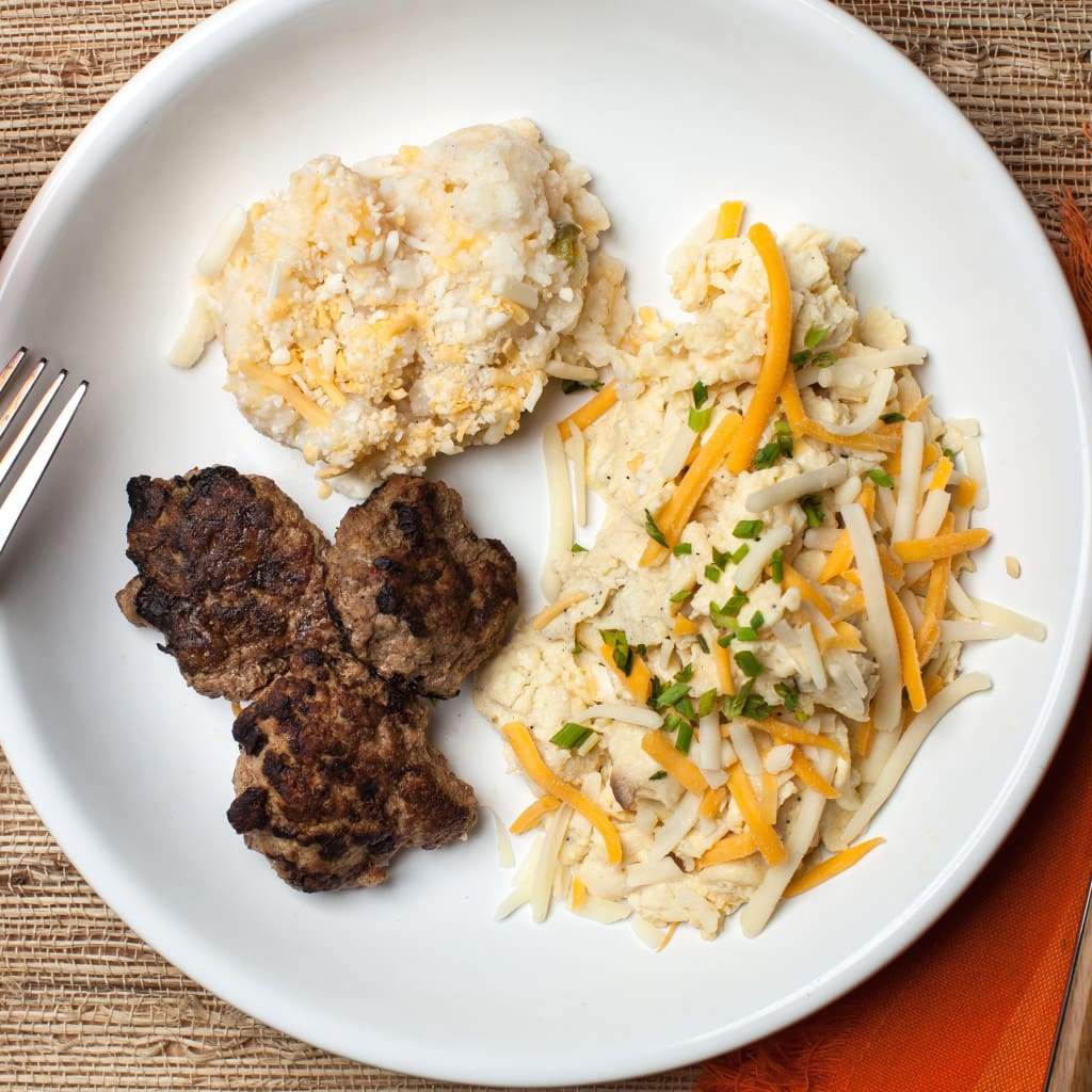 Turkey Sausage W/ Cheesy Jalapeño Grits & Egg Scramble